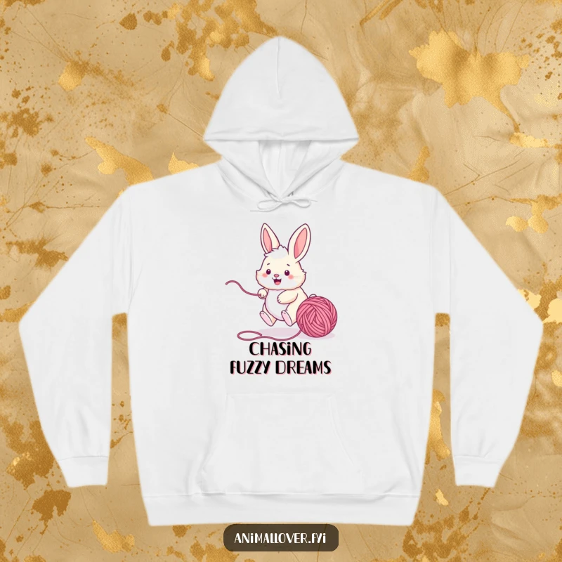Funny bunny hoodie design showcasing a happy rabbit energetically chasing a ball of yarn, perfect for cozy days and playful moments.