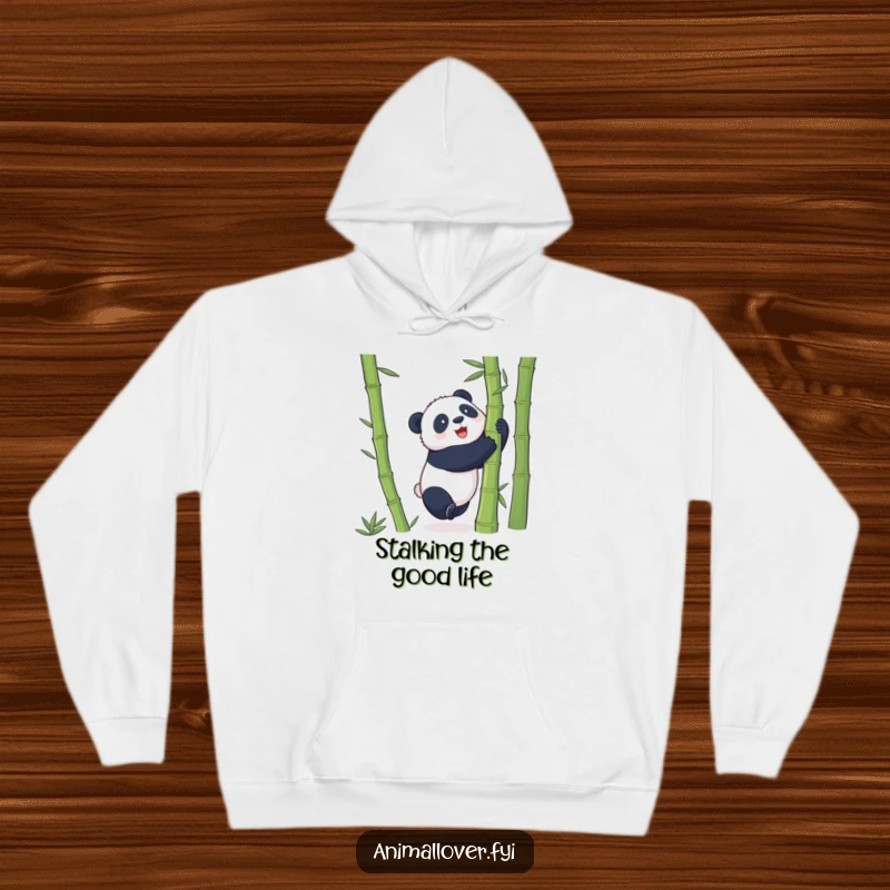 Funny Hoodie featuring a playful panda trying to embrace a giant bamboo stalk, radiating warmth and adorable effort.
