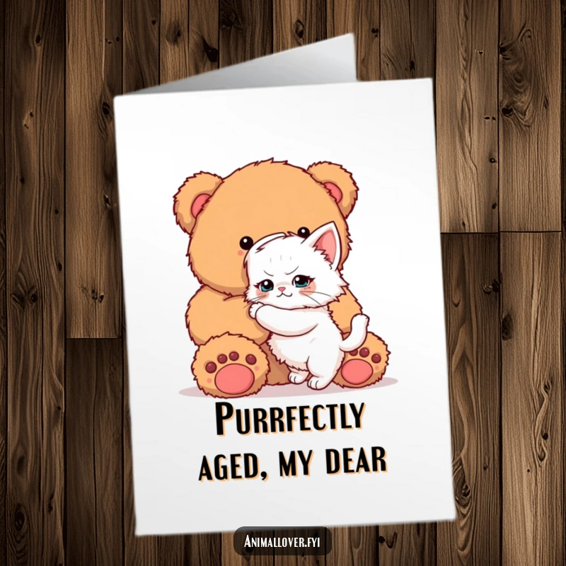 Funny Free Printable Kitten Birthday Card: A determined kitten bravely hugs a giant teddy bear for a birthday wish.