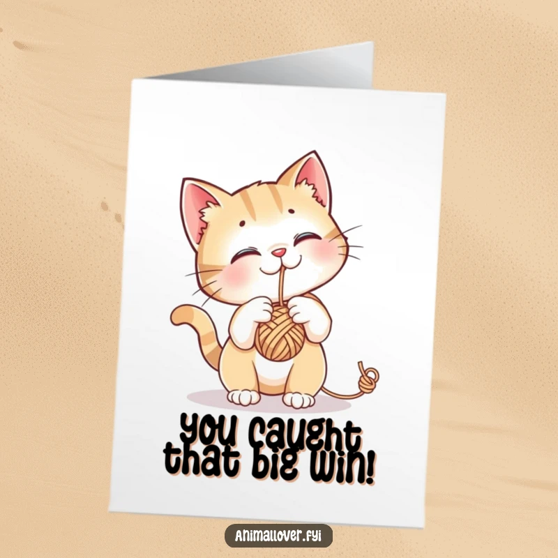 Funny Free Printable Congratulations Card: A curious cat batting at a yarn ball, celebrating a successful achievement.